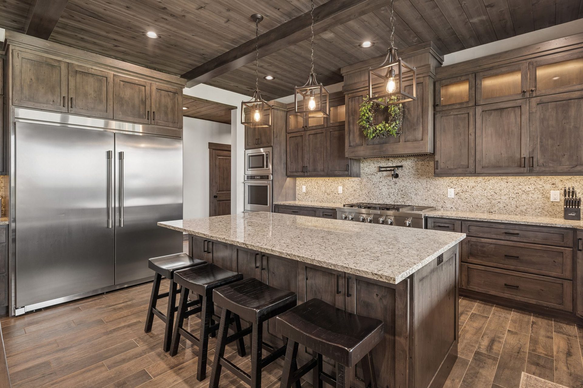 Commercial chef's kitchen with granite island where the private chef prepares each meal