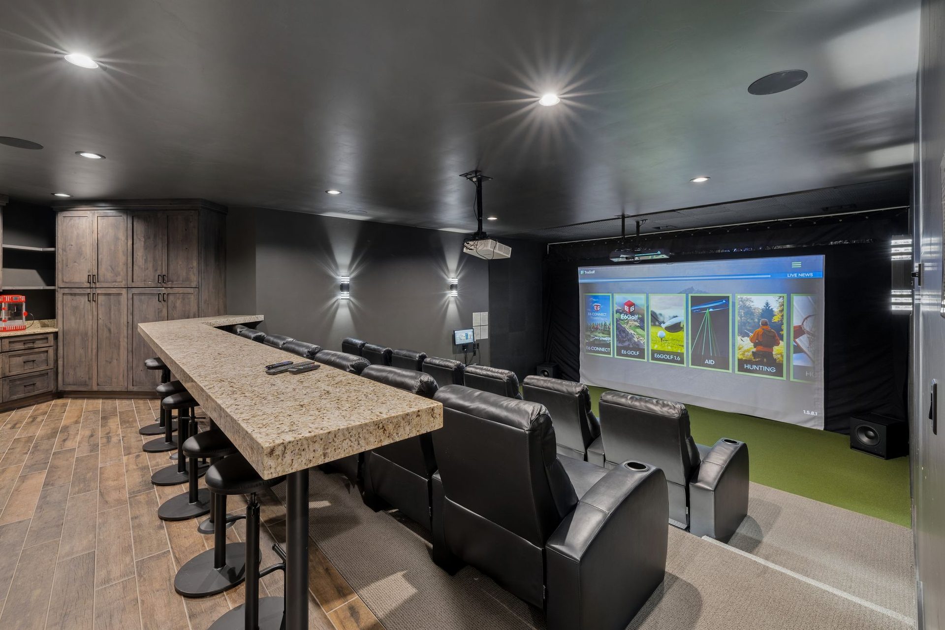 16-foot presentation theater with tiered leather recliners and cinema-scale screen